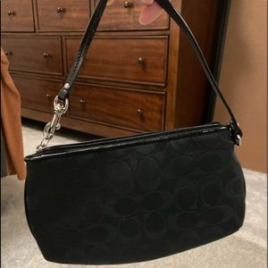 Two genuine Coach handbags. One large and one cutch/wallet type.